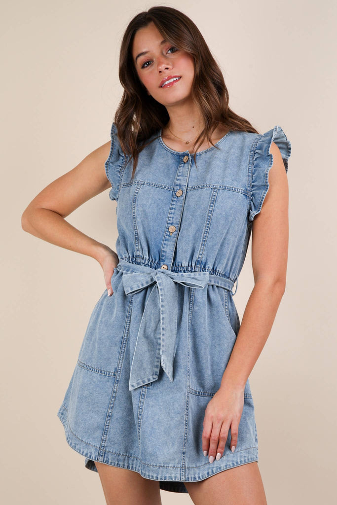 Washed chambray ruffle mini dress with button down and tie, available at Bailey’s Boutique Ohio.
